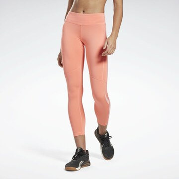 Reebok Skinny Športové nohavice - oranžová