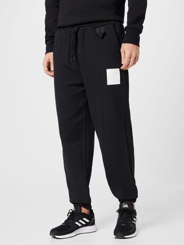 Tapered Pantaloni sportivi 'Lounge Heavy French Terry' di ADIDAS SPORTSWEAR in nero: frontale