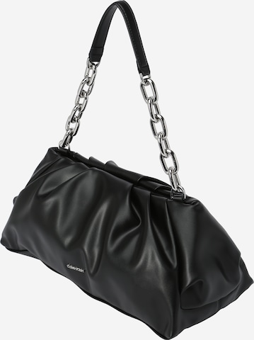 Calvin Klein - Clutches em preto: frente