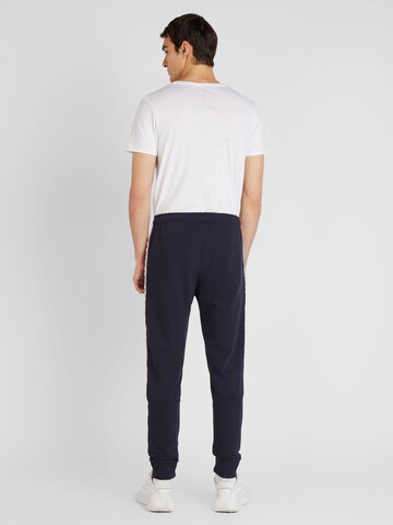 Tapered Pantaloni de la Champion Authentic Athletic Apparel pe albastru