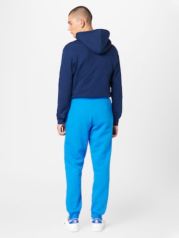 ADIDAS ORIGINALS Zwężany krój Spodnie 'Trefoil Essentials' w kolorze niebieski