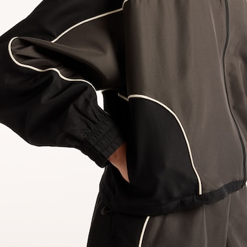 new balance Between-season jacket 'Trackside' in Brown