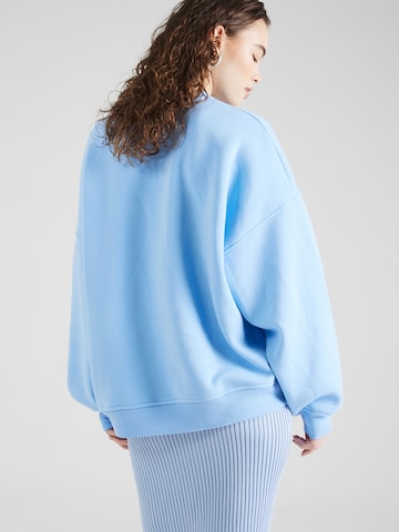 Sweat-shirt 'June' florence by mills exclusive for ABOUT YOU en bleu