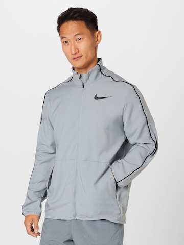 NIKE Sports sweat jacket in Grey: front