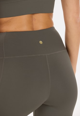 Athlecia Skinny Sportbroek 'Elli' in Bruin