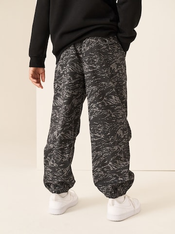 Next - Tapered Pantalón en negro