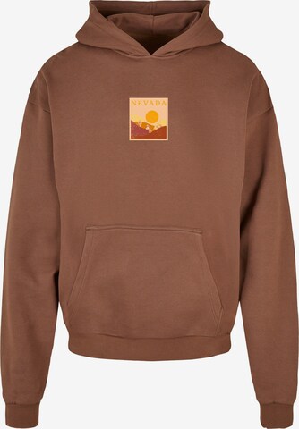 Merchcode Sweatshirt 'Peanuts - Nevada' in Bruin: voorkant