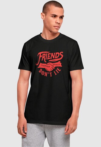 T-Shirt 'Stranger Things - Friends Dont Lie' ABSOLUTE CULT en noir : devant