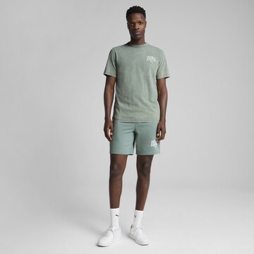 PUMA Shirt 'Class' in Green: front