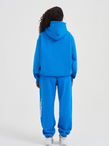 Effilé Pantalon fonctionnel AND1 en bleu