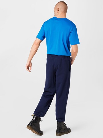 Tapered Pantaloni sportivi di Lacoste Sport in blu