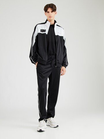 Champion Authentic Athletic Apparel Tracksuit in Black: front