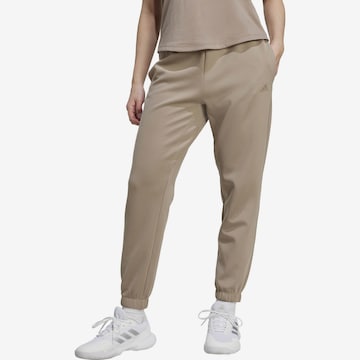 ADIDAS PERFORMANCE Tapered Urheiluhousut 'MOTION ES' värissä beige: etupuoli