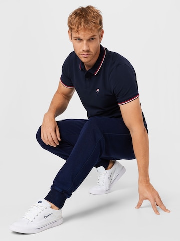 Superdry Tapered Nadrág - kék