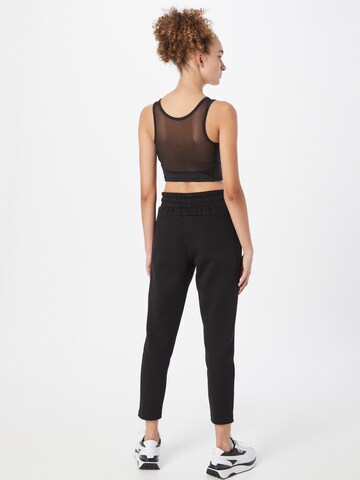 Effilé Pantalon de sport PUMA en noir