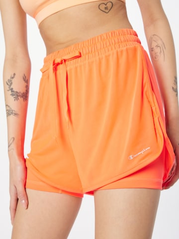 Champion Authentic Athletic Apparel Regularen Športne hlače | oranžna barva