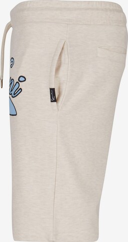 Karl Kani Regular Trousers in Beige