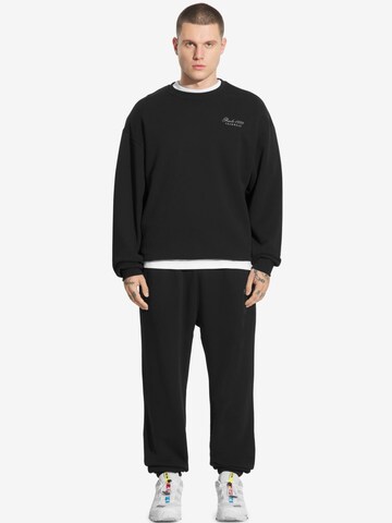 Prosto Tapered Workout Pants 'Football' in Black: front