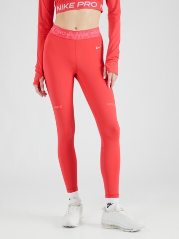 NIKE Skinny Spodnie sportowe w kolorze różowy: przód