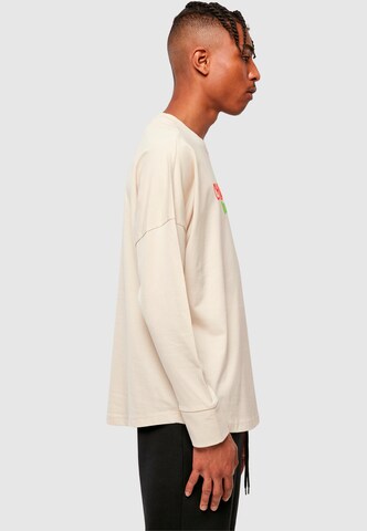 T-Shirt 'Christmas Vibes' Merchcode en beige