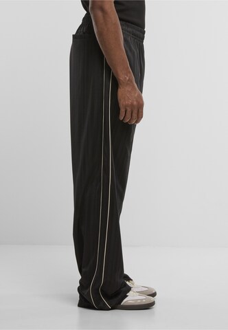 Regular Pantalon Karl Kani en noir