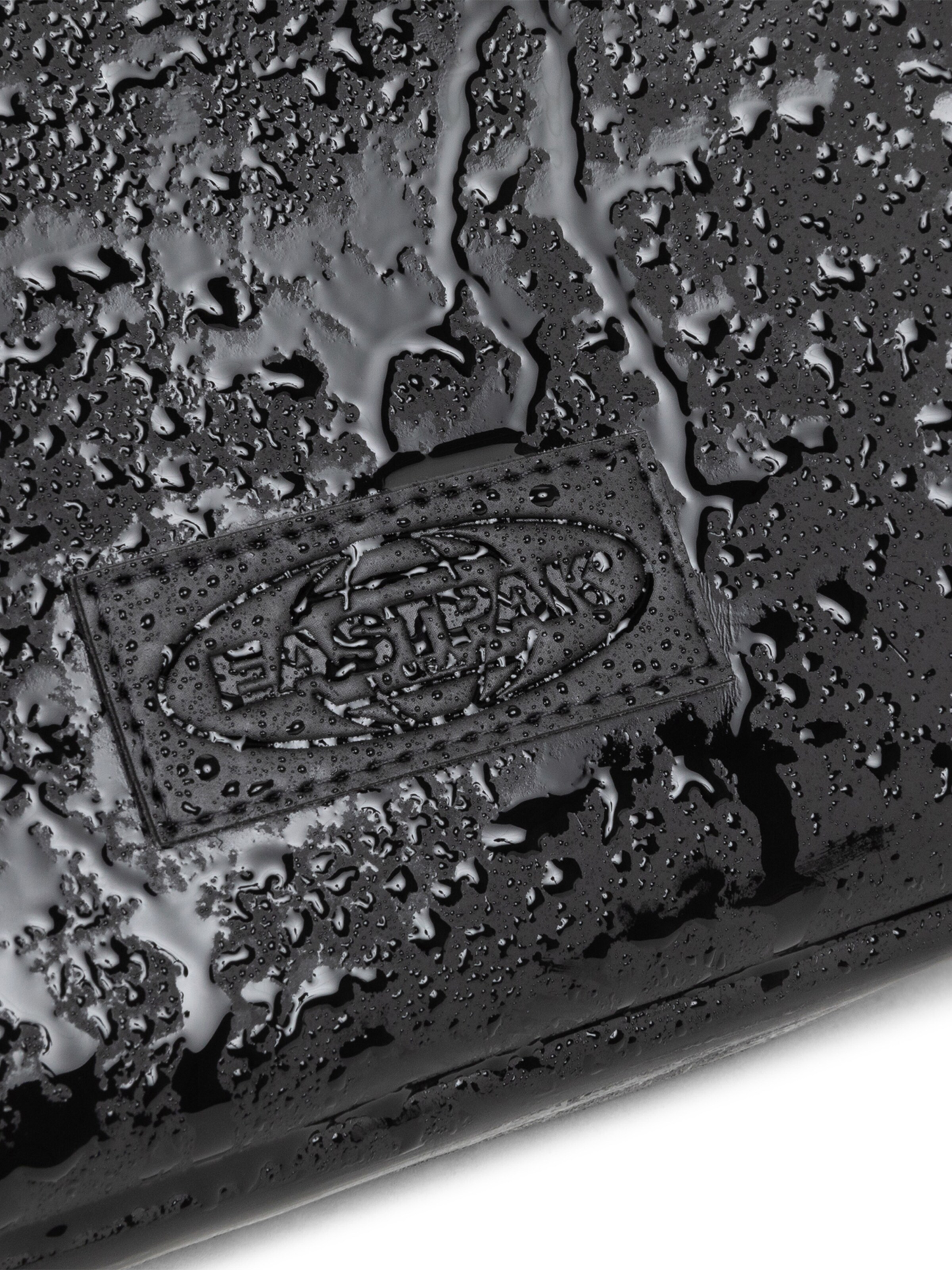 EASTPAK Taška cez rameno 'ARJAN' - Čierna