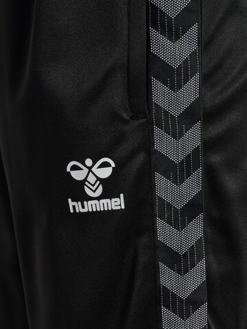 Coupe slim Pantalon de sport Hummel en noir