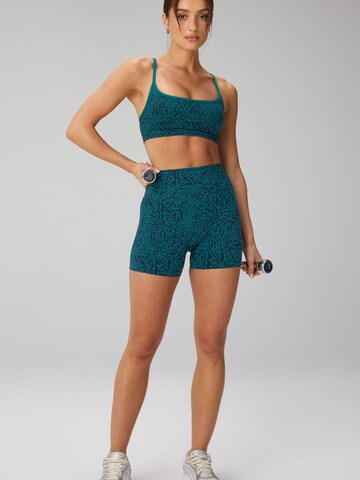 Fabletics Regular Shorts 'SEAMLESS SCRUNCH SHORT 4"` in Grün