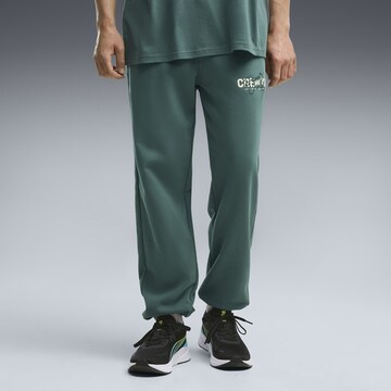PUMA Regular Sports trousers in Green: front
