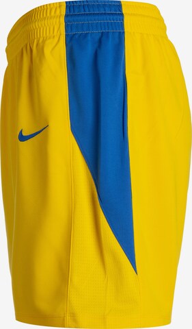 NIKE Loose fit Workout Pants in Yellow