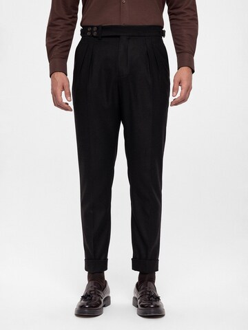 Antioch Tapered Pleat-front trousers in Black: front