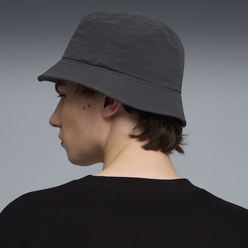 PUMA Hoed 'Premium Essentials' in Zwart