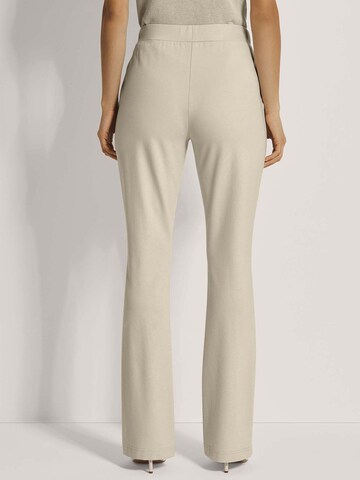 MADELEINE Flared Broek in Beige