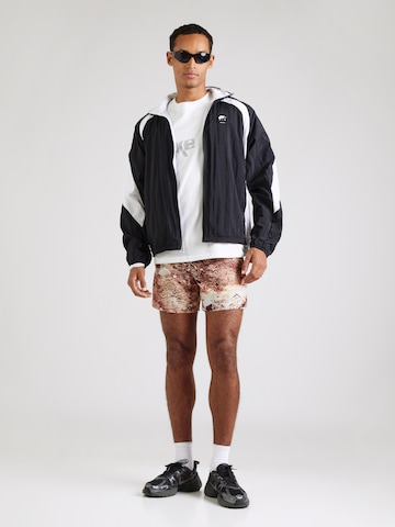 Regular Pantaloni sport de la NIKE pe bej