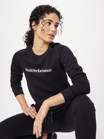 PEAK PERFORMANCE Sportsweatshirt i svart