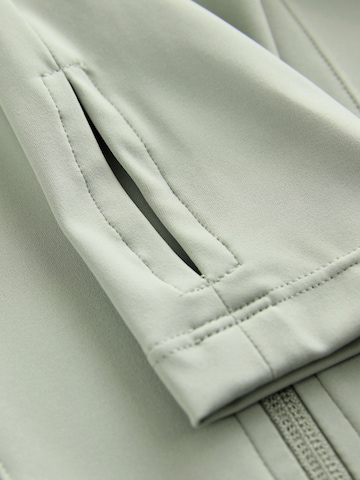 Cardigan self. en vert