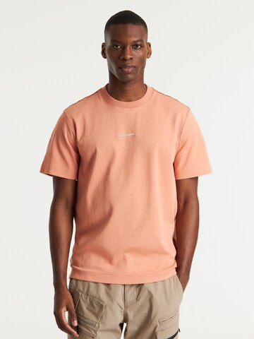 T-Shirt 'Swirl' CHASIN' en orange : devant