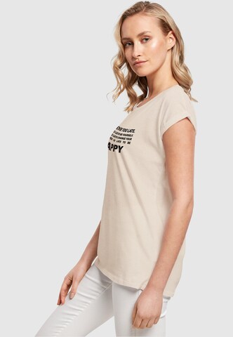 T-shirt 'Never Too Late' Merchcode en beige