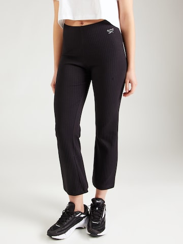 Reebok Flared Sports trousers in Black: front