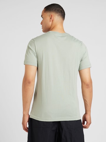 Nike Sportswear Regular fit T-shirt 'Swoosh' i grön