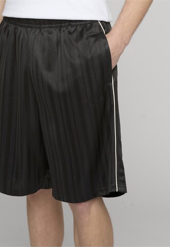 Loosefit Pantaloni di Karl Kani in nero