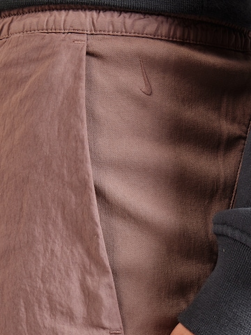 Nike Sportswear Normalny krój Spodnie 'ESC CMPTNL 2.0' w kolorze fioletowy