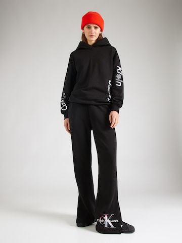 Calvin Klein JeansFlared/zvonoliki kroj Hlače - crna boja