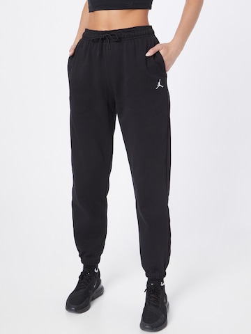 Jordan Tapered Trousers in Black: front