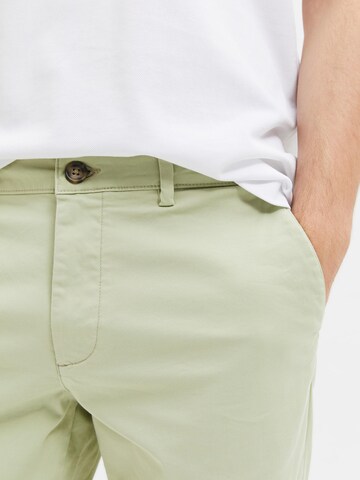 Coupe slim Pantalon chino 'Miles Flex' SELECTED HOMME en vert