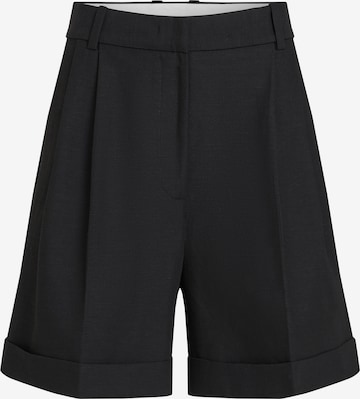 TOMMY HILFIGER Regular Pleat-front trousers in Black: front