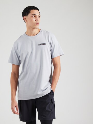 Maglia funzionale di UNDER ARMOUR in grigio: frontale