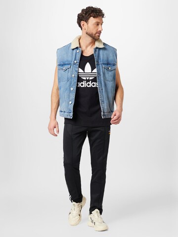 regular Pantaloni 'Beckenbauer' di ADIDAS ORIGINALS in nero