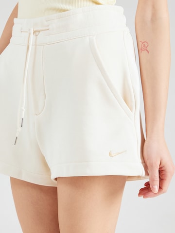 Nike Sportswear Обычный Штаны в Бежевый