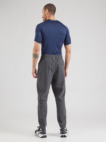 Nike Sportswear Tapered Trousers in Grey